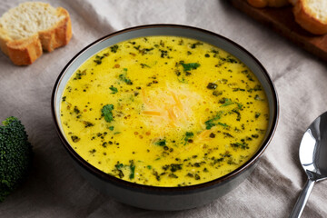 Homemade Broccoli and Cheddar Soup in a Bowl, side view.