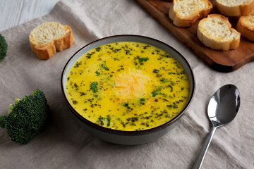 Homemade Broccoli and Cheddar Soup in a Bowl, side view.