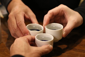hands holding cup