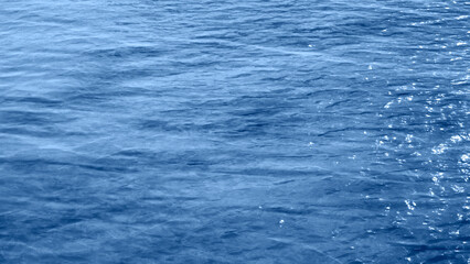 calm blue sea, deep dark black ocean background, smooth curve wave line texture, sunset summer spring wallpaper