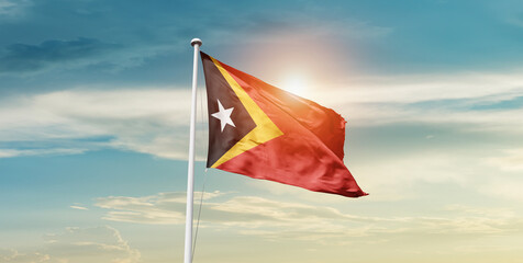 East Timor national flag cloth fabric waving on the sky - Image