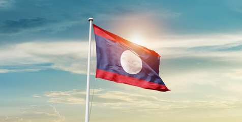 Laos national flag cloth fabric waving on the sky - Image - Powered by Adobe