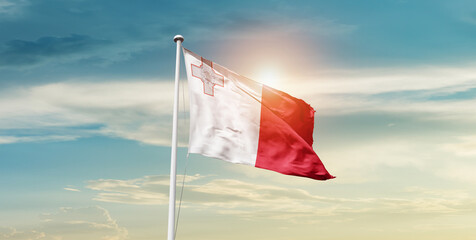 Malta national flag cloth fabric waving on the sky - Image