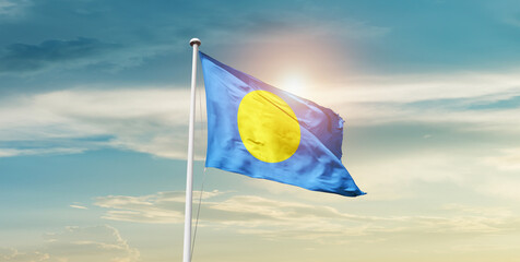 Palau national flag cloth fabric waving on the sky - Image