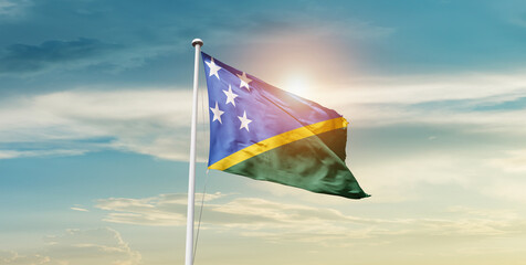 Solomon Islands national flag cloth fabric waving on the sky - Image