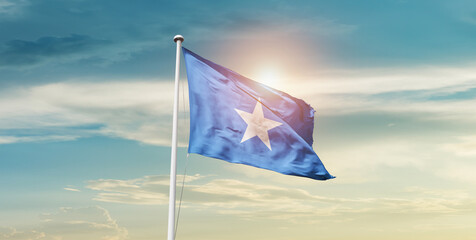 Somalia national flag cloth fabric waving on the sky - Image