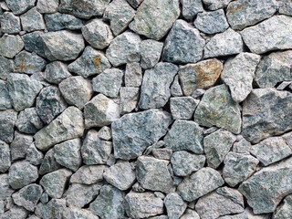 Wall stone texture background. Granite wall.