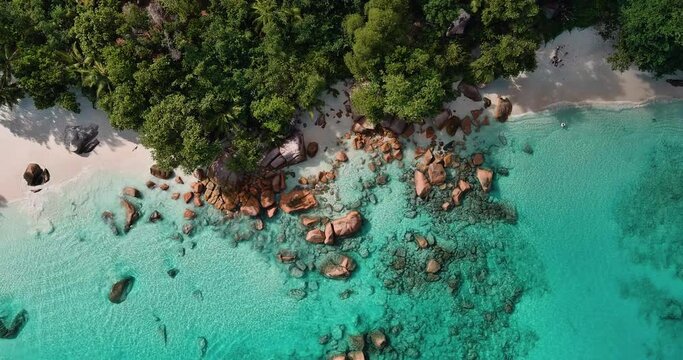 Sraight down aerial panning view of the magnificent Anse Lazio beach with it's azure coloured waters Praslin,Seychelles