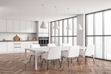 Corner view on bright kitchen room interior with cupboard, table