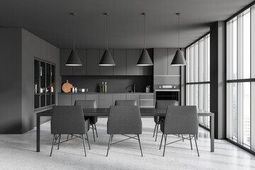 Grey kitchen interior with eating table and chairs, shelves and panoramic window