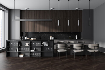 Grey kitchen interior with eating table and countertop, kitchenware and window