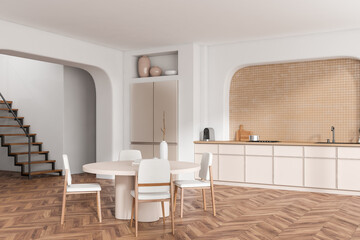 Stylish kitchen interior with dining and cooking area, decoration and stairs