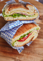 Italian ciabatta bread sandwich with rucola , tomatoes and  prosciutto  crudo