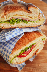 Italian ciabatta bread sandwich with rucola , tomatoes and  prosciutto  crudo