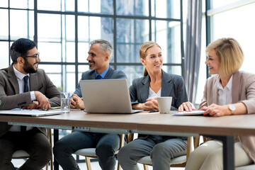 Business meeting - manager discussing work with his colleagues.