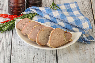 Baked pork tenderloin served rosemary