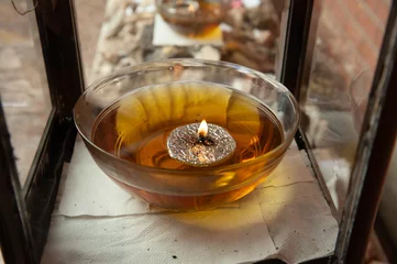Fotobehang A memorial flame burns in a large bowl of oil at a gravesite in Jerusalem. © Yehoshua Halevi