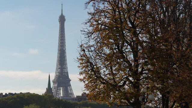 Autumn in Paris. 4K video with the silhouette of Eiffel Tower during a sunny day with blue sky. Travel to France.