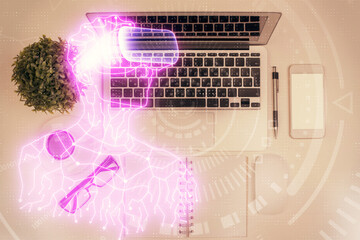 AR hologram drawings over computer on the desktop background. Top view. Multi exposure. Concept of augmented reality.