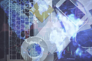 Double exposure of financial chart drawing over table background with computer. Concept of research and analysis. Top view.