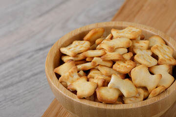 Wooden bowl of delicious goldfish crackers
