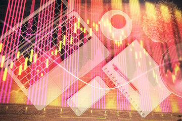 Obraz premium Financial market graph and top view computer on the desktop background. Double exposure. Investment concept.