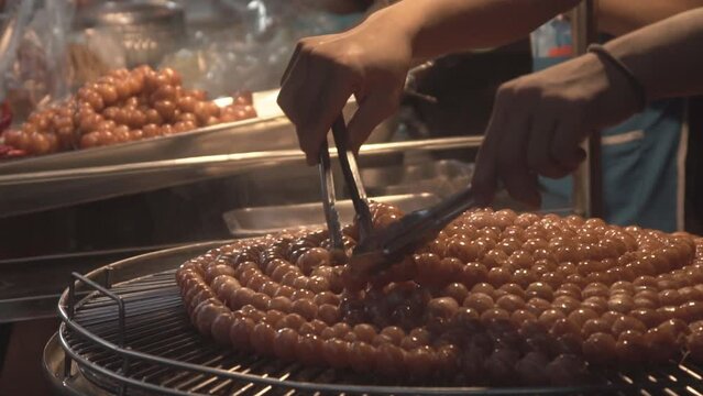 Thai isaan sausage cooking, close up.