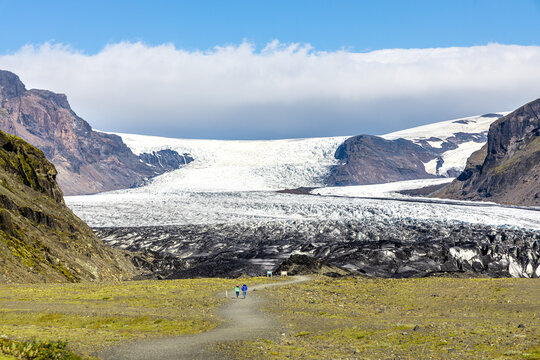 Vatnajokull is the largest and most voluminous ice cap glacier in Iceland. Visitors taking a short trail hikes to the edge of the glacier from visitor center