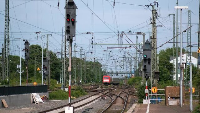 Two simultaneously arriving passenger commuter trains to Dortumnd station in Germany.