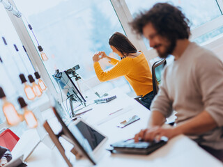 A young woman using a camera to present her business with online clients 
