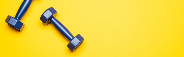top view blue dumbbells yellow