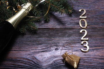 Happy New Year. Symbol from number 2023 on wooden background
