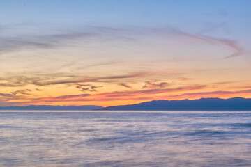 Fototapeta na wymiar Sunset on Lake Baikal in the Barguzin Bay. Republic of Buryatia, Maksimikha settlement.