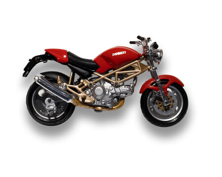 Red toy model motorcycle Ducati isolated on transparent background, side view