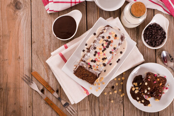 Sponge cake with white frosting and sugars.