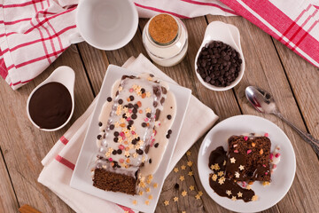 Sponge cake with white frosting and sugars.