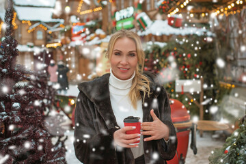 Christmas fair, Holidays magical vibe, winter's day with a snow, tourist lady at Europe