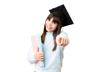 Little caucasian student girl over isolated background pointing front with happy expression