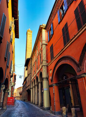 Fototapeta na wymiar Garisenda tower seen from Maggiore street, Bologna city, Italy