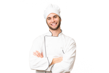 Young handsome chef man over isolated background keeping the arms crossed in frontal position