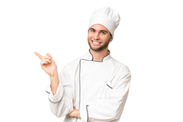 Young handsome chef man over isolated background pointing finger to the side