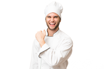 Young handsome chef man over isolated background celebrating a victory