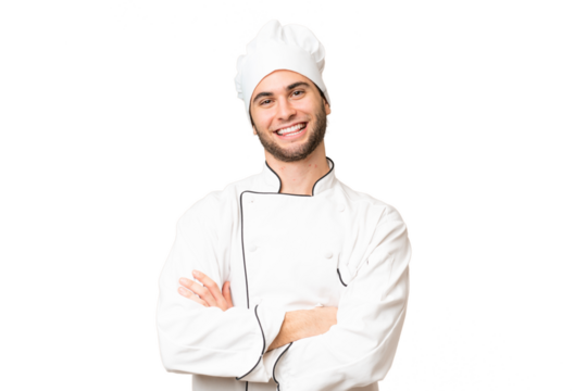 Young handsome chef man over isolated background keeping the arms crossed in frontal position