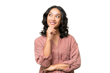 Young Argentinian woman over isolated background thinking an idea while looking up