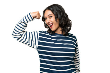Young Argentinian woman over isolated background doing strong gesture