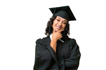 Young university graduate Argentinian woman over isolated background smiling