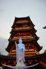 A Pagoda in the center of a Chinatown with the statue of Guan Yin.