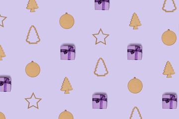 Winter pattern made Christmas tree, bauble, star and gift box on pastel purple background. Creative wallpaper decoration. Minimal winter season idea. Creative New Year concept.