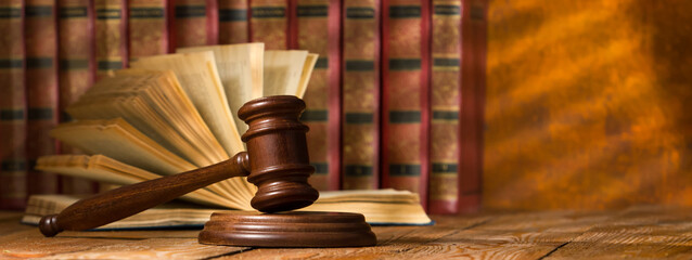 Law and justice concept. Mallet gavel of the judge, scales of justice, books. Copy space for text