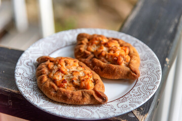 Traditional Karelian pie Kalitka. Small pies with open fillings. National food. Traditional dish of North Russian cuisine.